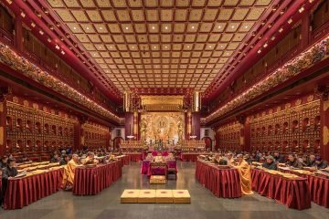 Praying monks and nuns in the Buddha Tooth Relic Temple of Singapore